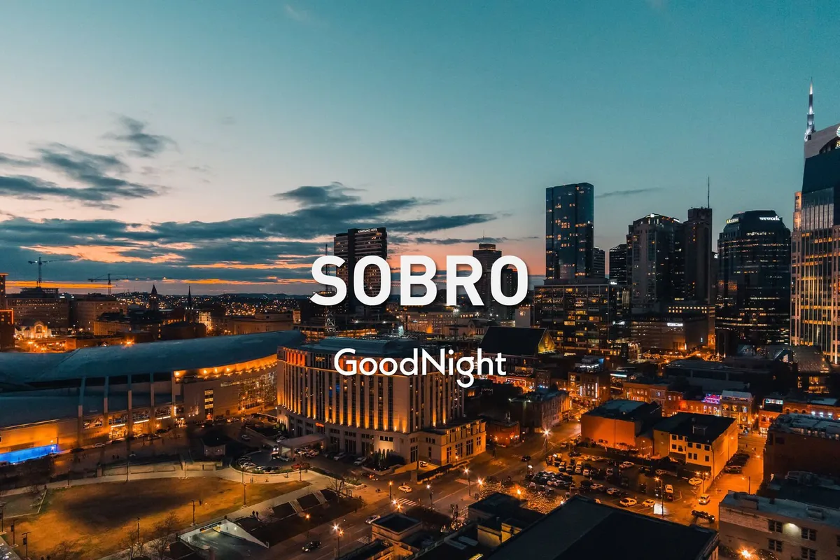 A sweeping city skyline at sunset with buildings bathed in golden light. The view captures the vibrancy of Nashville, hinting at the lively urban atmosphere accessible from Melody Row's rooftop spaces.